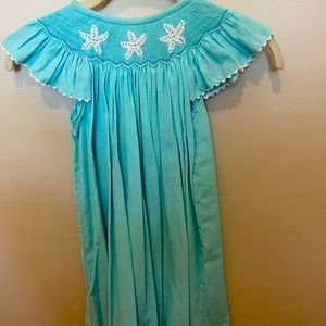 Teal blue smocked dress. Beach theme. Size 6